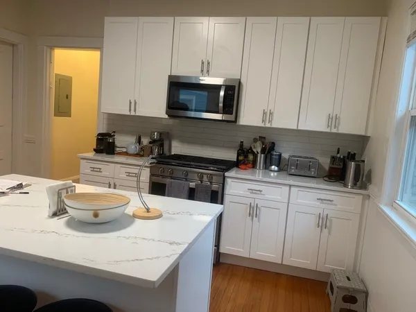 a bedroom with a bed and lamp