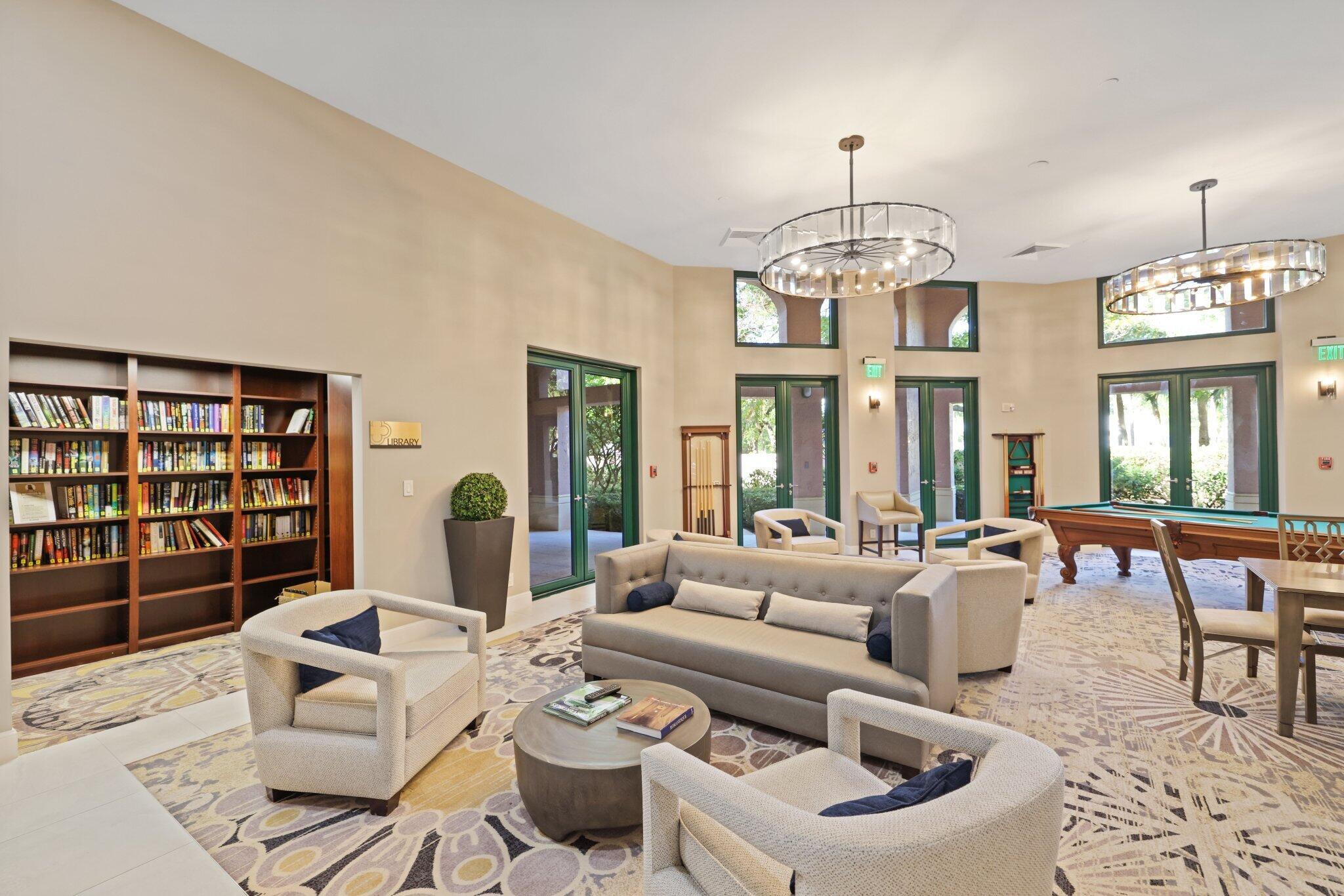 100 Southeast 5th Avenue, Unit 106 Boca Raton, FL 33432 - Photo 62 of 81 a living room with furniture a chandelier and a large window