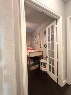 a room that has a bed and a chair in it