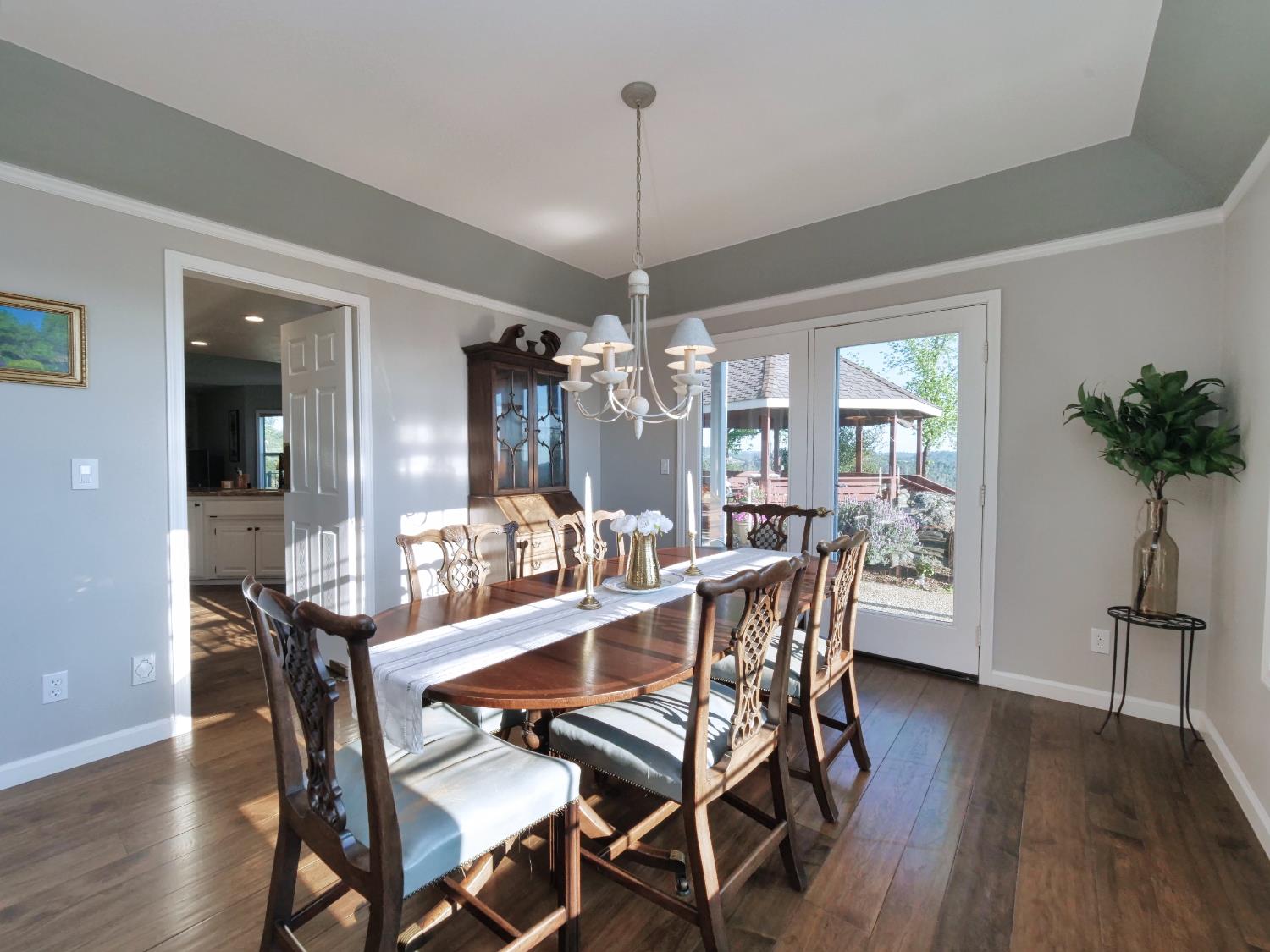 2405 Greensboro Road Placerville, CA 95667 - Photo 14 of 99 a view of a dining room with furniture window and wooden floor
