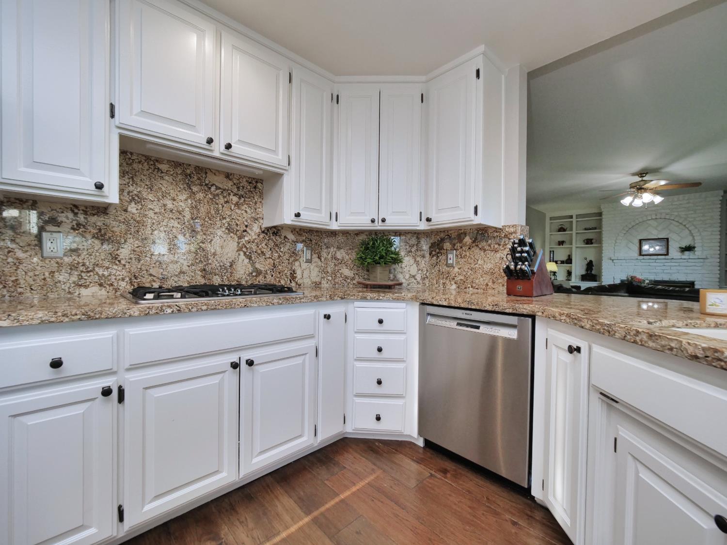 2405 Greensboro Road Placerville, CA 95667 - Photo 18 of 99 a kitchen with granite countertop white cabinets and white appliances