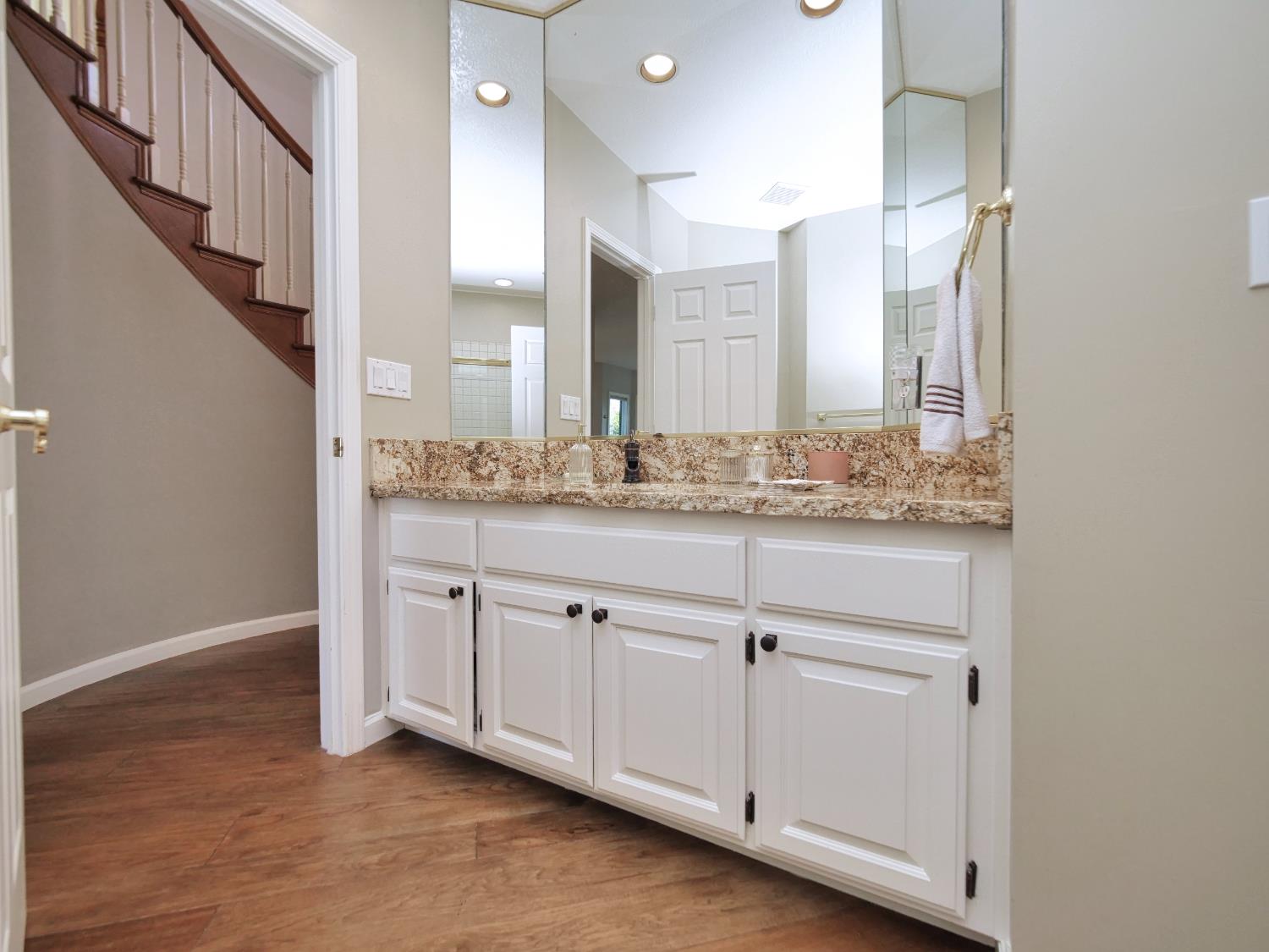 2405 Greensboro Road Placerville, CA 95667 - Photo 30 of 99 a spacious bathroom with a granite countertop sink and a mirror