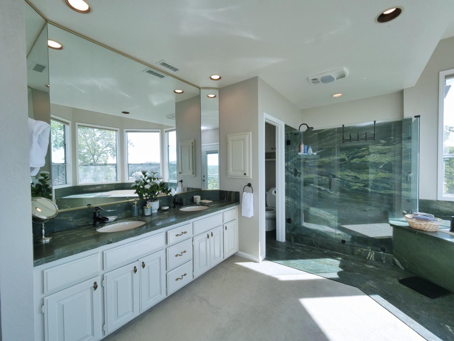 2405 Greensboro Road Placerville, CA 95667 - Photo 36 of 99 a large bathroom with double vanity and a large mirror