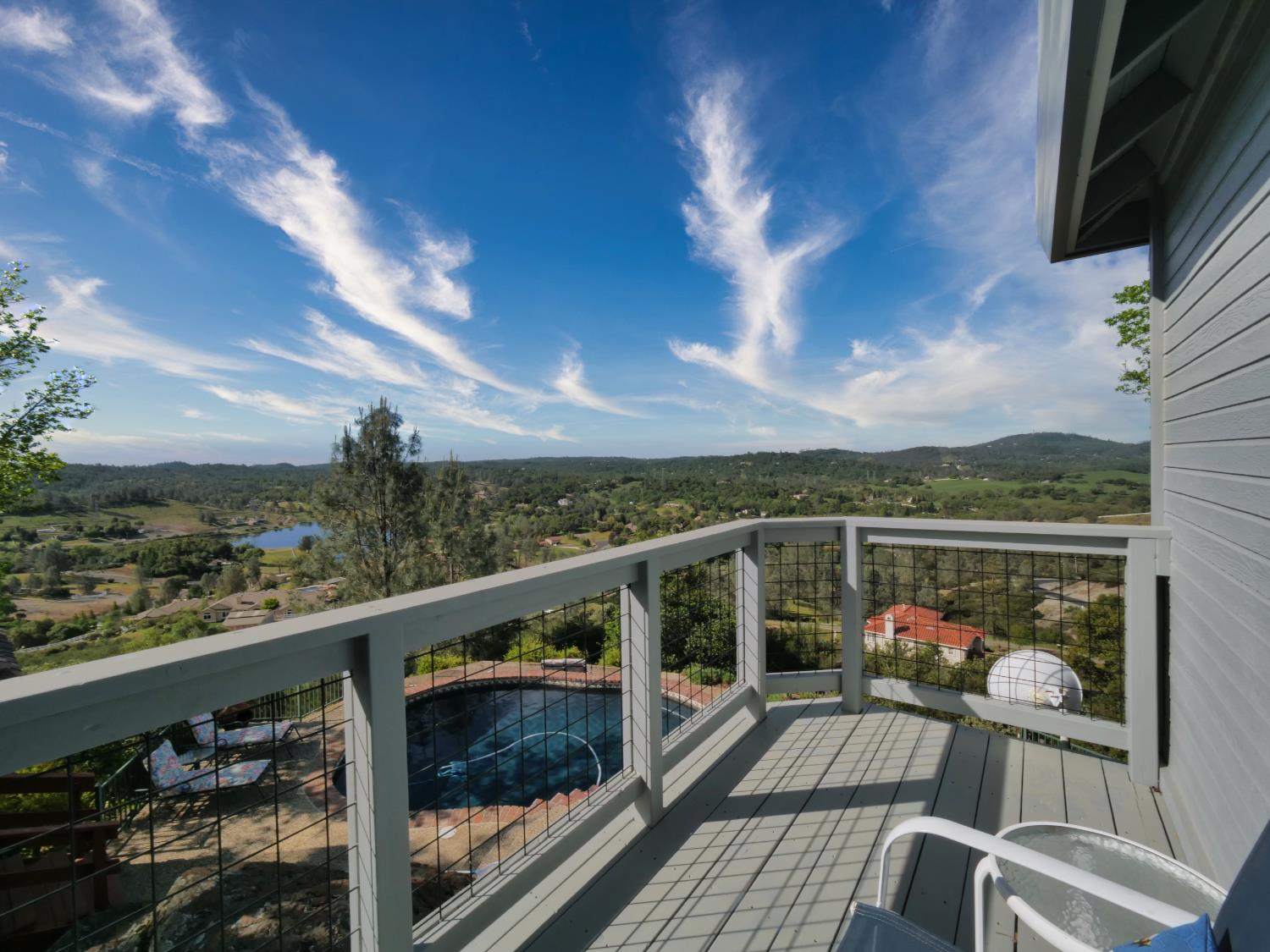 2405 Greensboro Road Placerville, CA 95667 - Photo 39 of 99 a view of a balcony with wooden floor and iron stairs