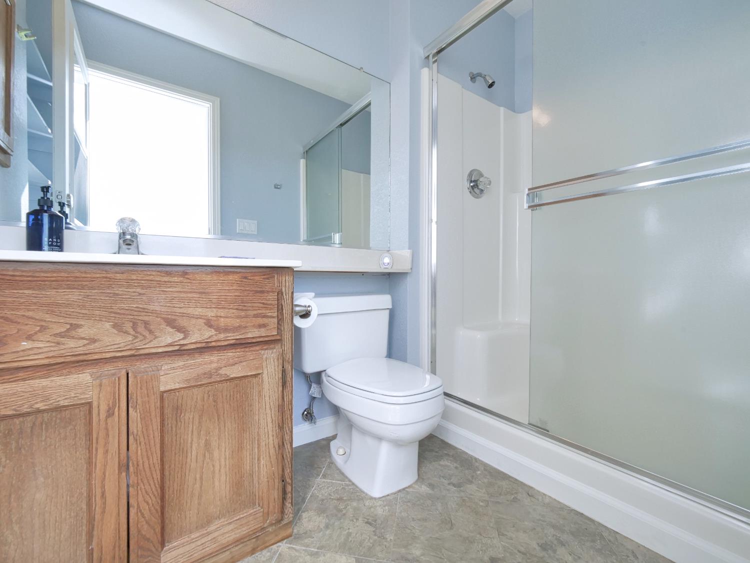 2405 Greensboro Road Placerville, CA 95667 - Photo 50 of 99 a bathroom with a toilet sink and mirror