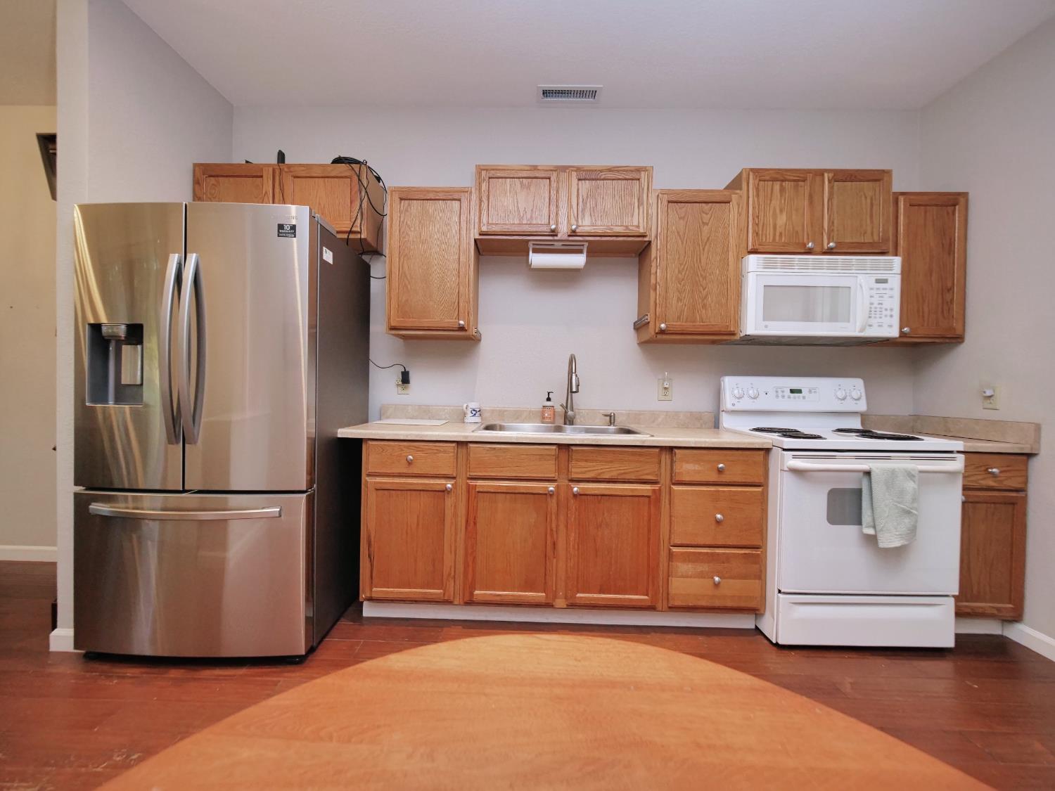 2405 Greensboro Road Placerville, CA 95667 - Photo 69 of 99 a kitchen with stainless steel appliances granite countertop a refrigerator and a stove top oven