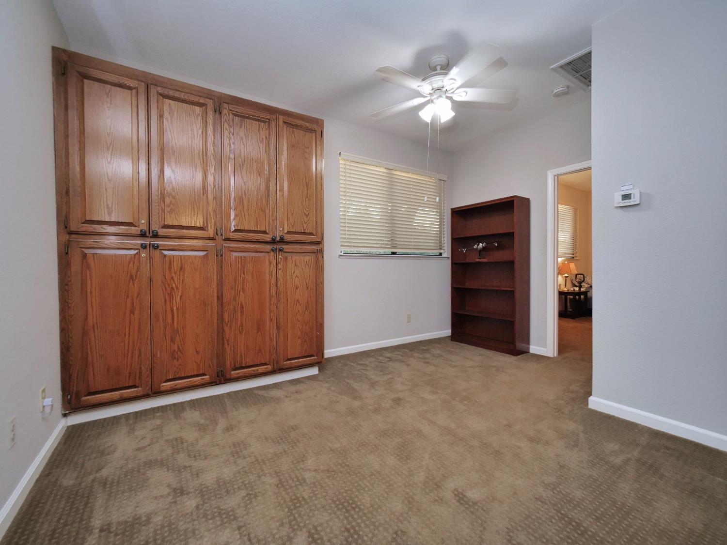 2405 Greensboro Road Placerville, CA 95667 - Photo 75 of 99 a view of an empty room with a ceiling fan