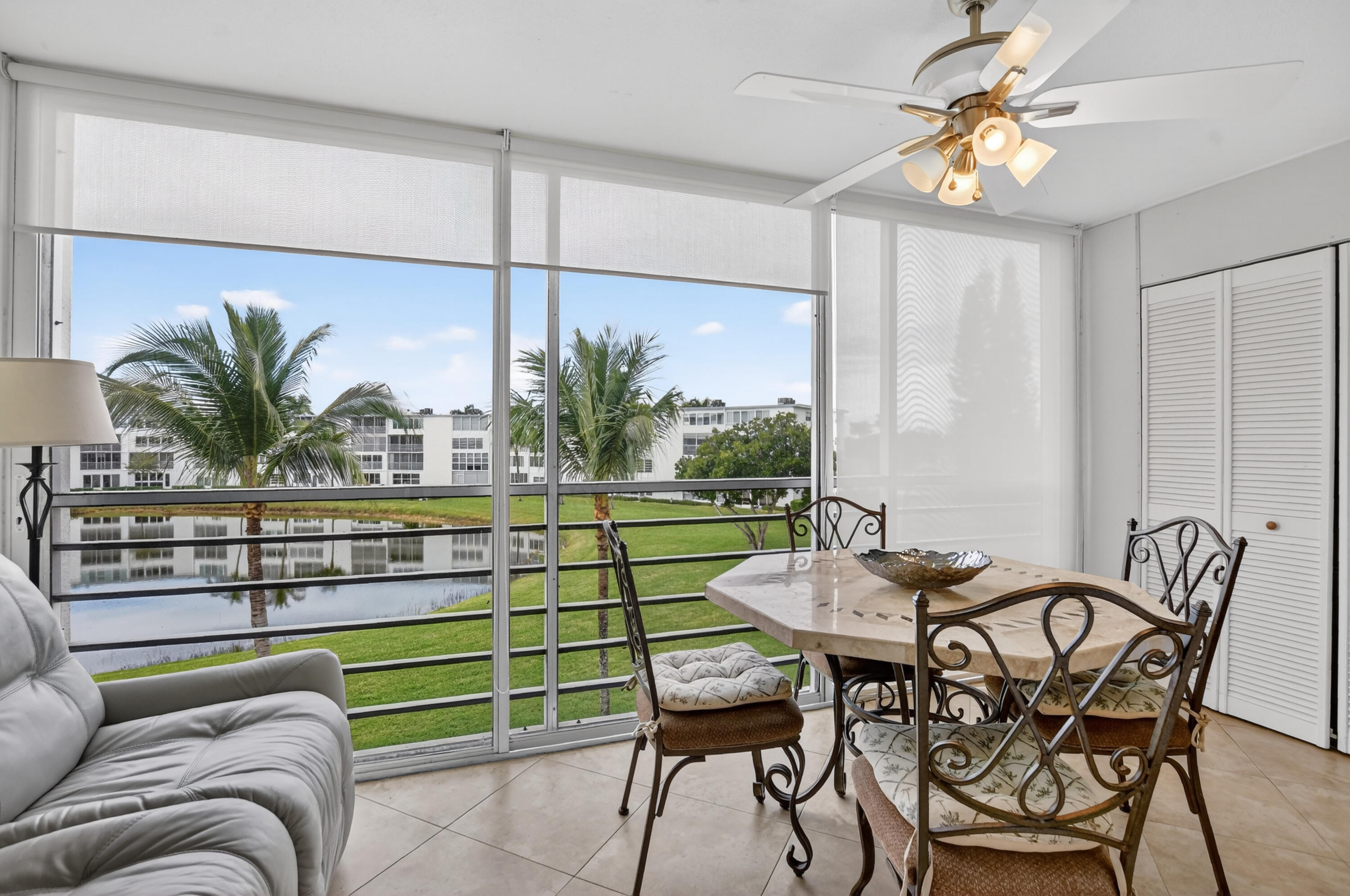 3009 Yarmouth C, Unit 3009 Boca Raton, FL 33434 - Photo 19 of 75 a view of a livingroom with furniture and window