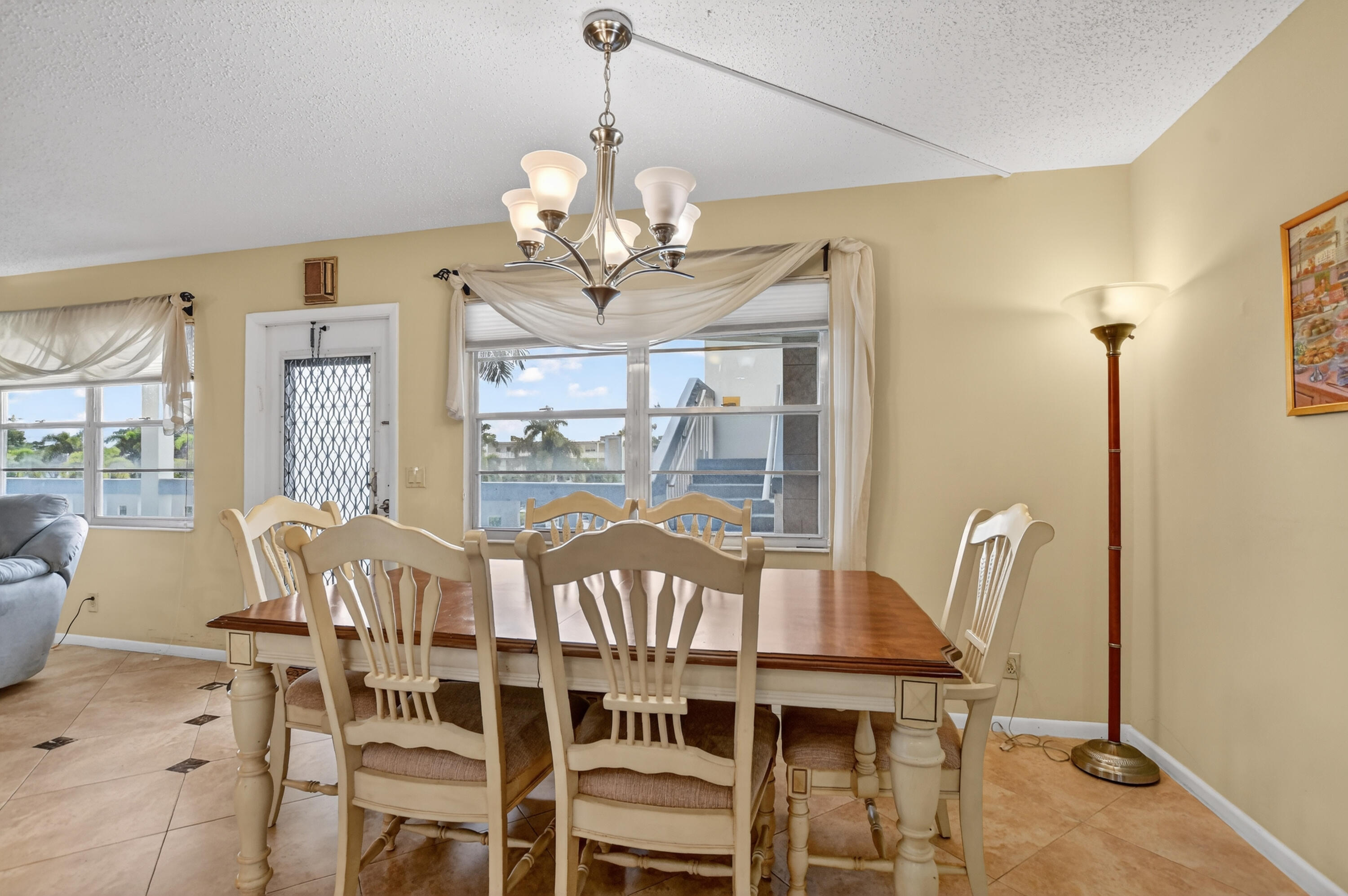 3009 Yarmouth C, Unit 3009 Boca Raton, FL 33434 - Photo 6 of 75 a view of a dining room with furniture window and outside view