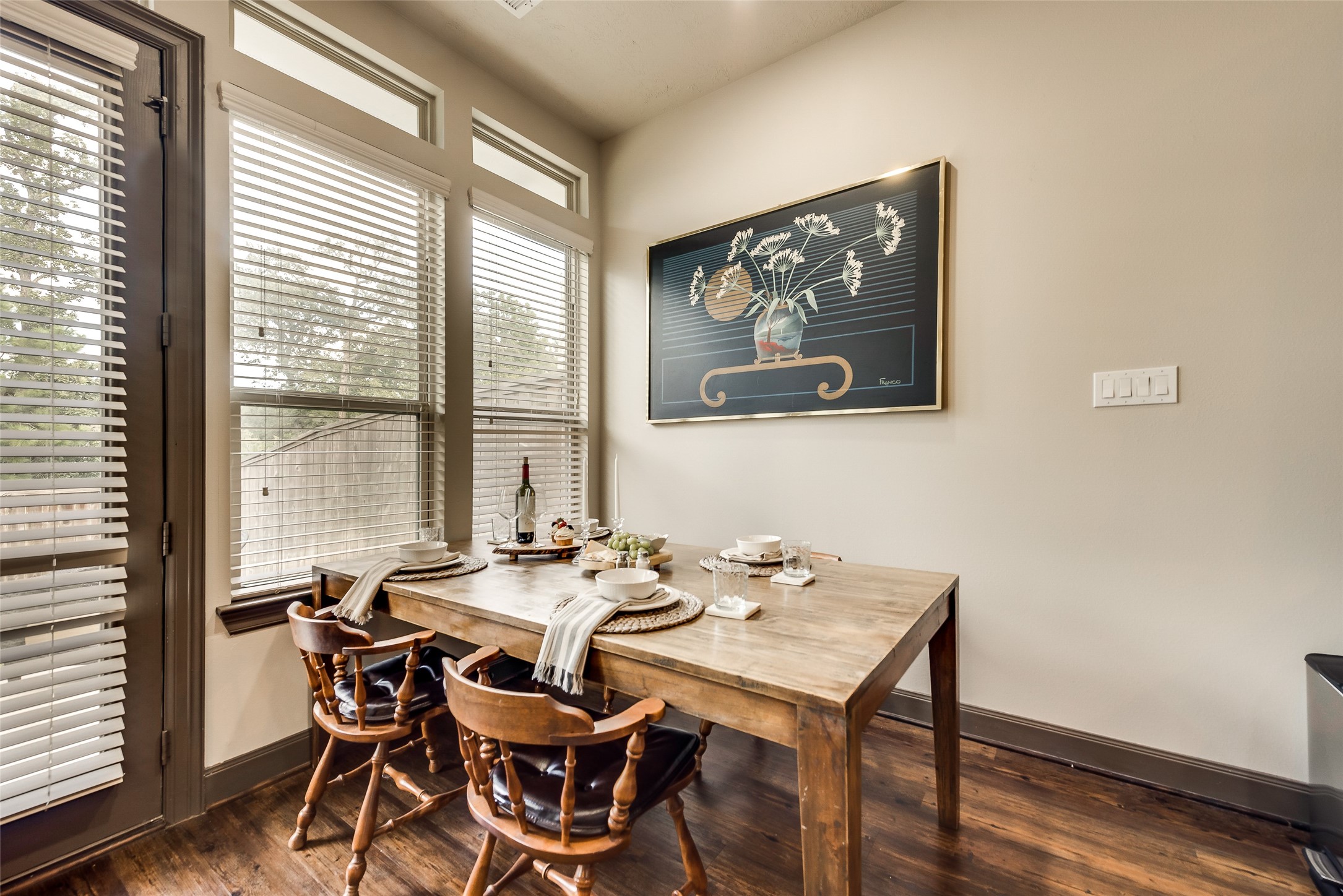 86 Aventura Place Spring, TX 77389 - Photo 6 of 23 a view of a dining room with furniture large window and wooden floor