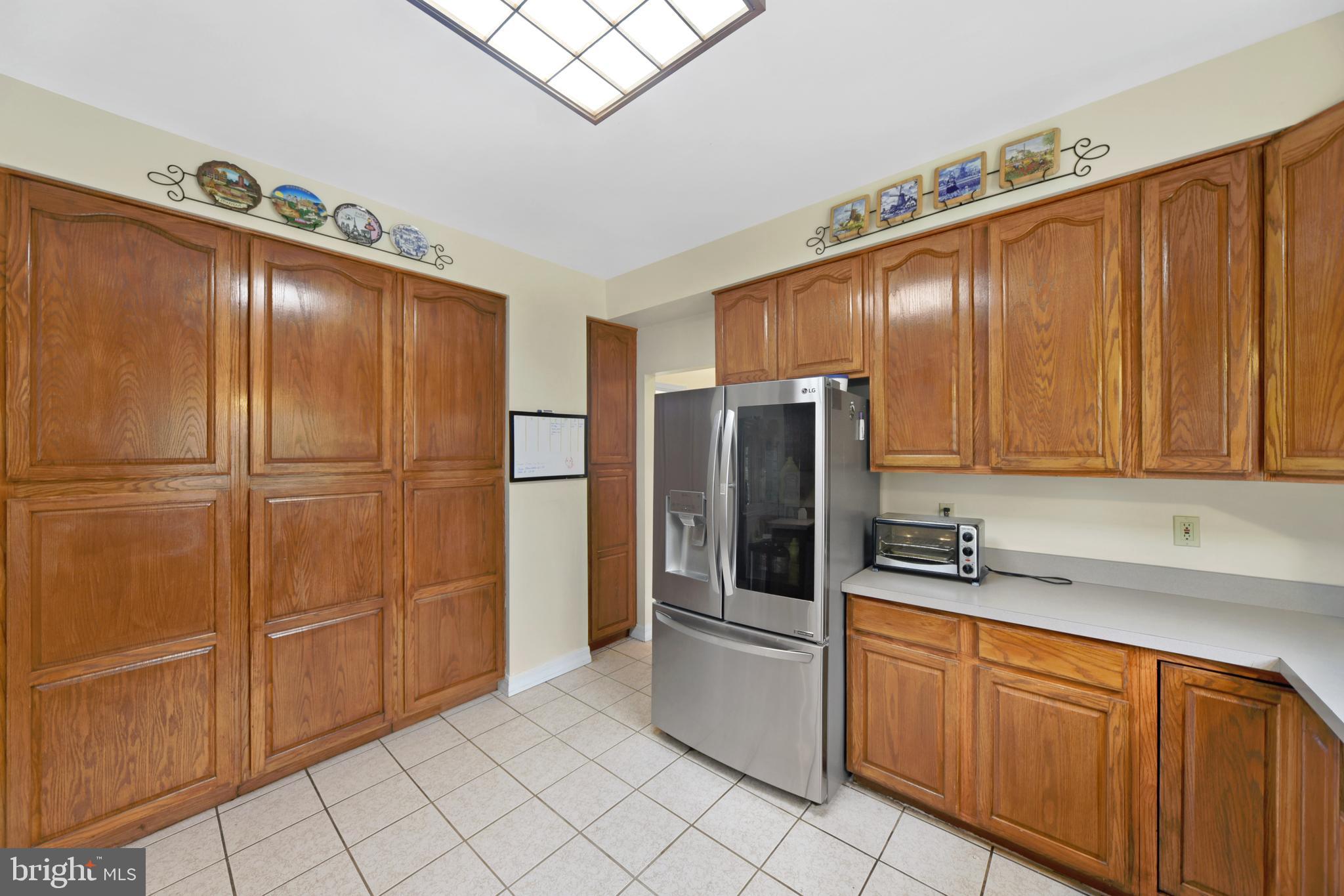 760 Gilbert Road Aberdeen, MD 21001 - Photo 20 of 50 a kitchen with stainless steel appliances granite countertop a refrigerator a sink and cabinets