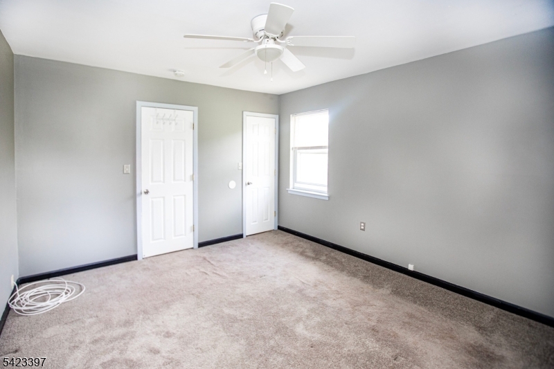 1130 Valley Road, Unit 2B Wayne, NJ 07470 - Photo 25 of 47 an empty room with windows and fan