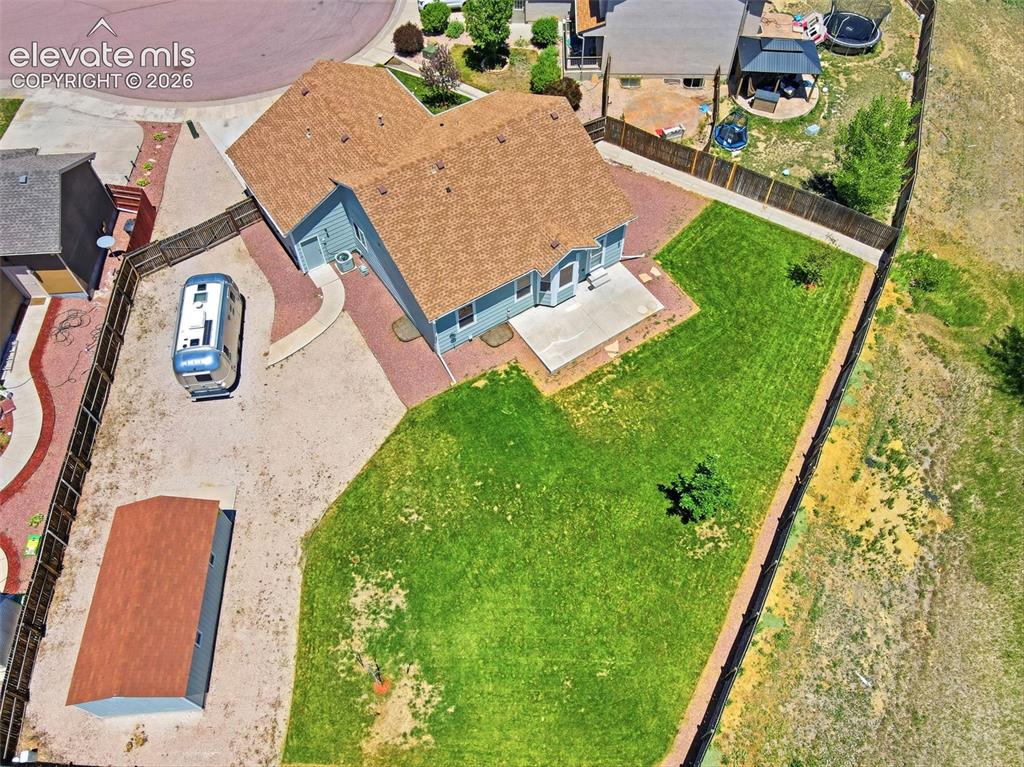 7806 Dutch Loop Colorado Springs, CO 80925 - Photo 40 of 41 an aerial view of a house with a yard