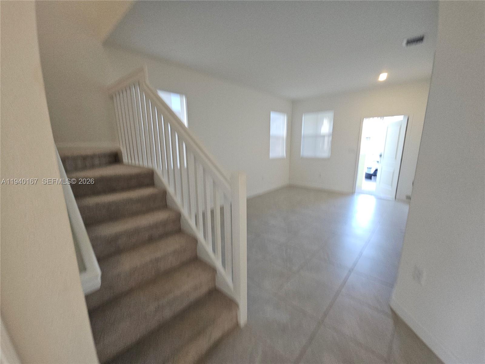 2530 Southeast 29th Street Homestead, FL 33035 - Photo 13 of 21 a view of entryway and hall with wooden floor