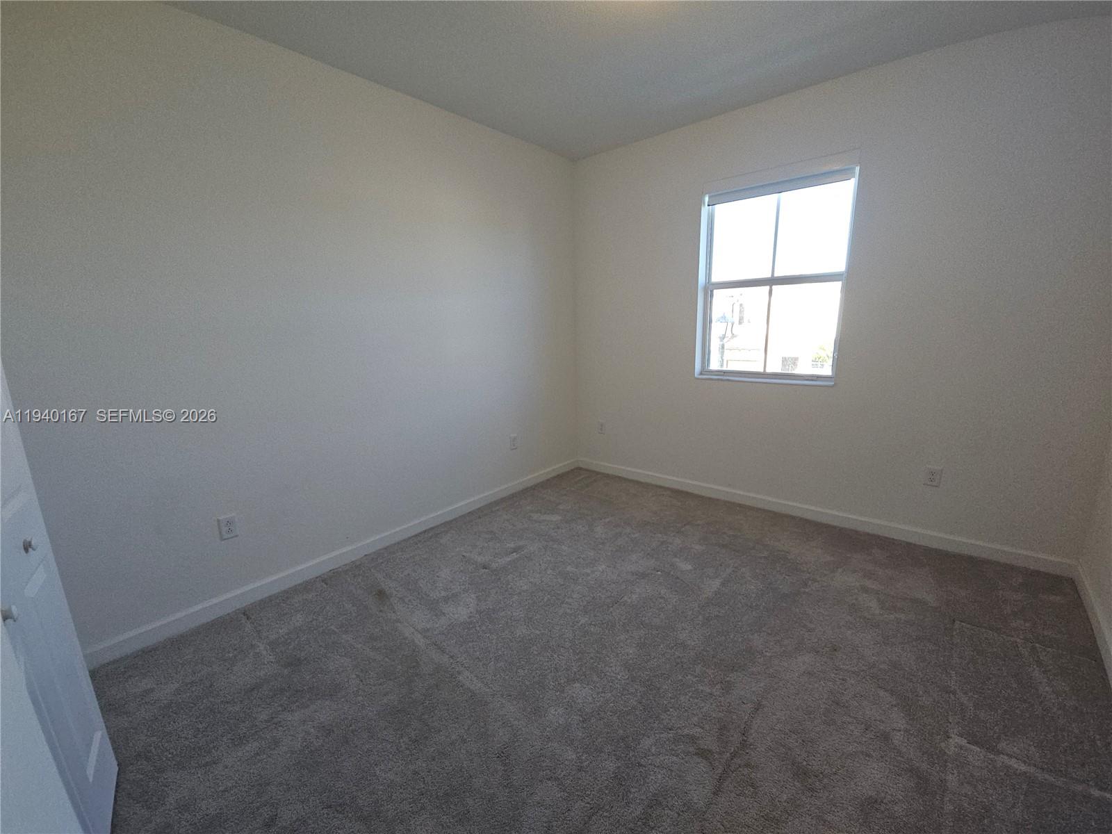 2530 Southeast 29th Street Homestead, FL 33035 - Photo 15 of 21 an empty room with a window
