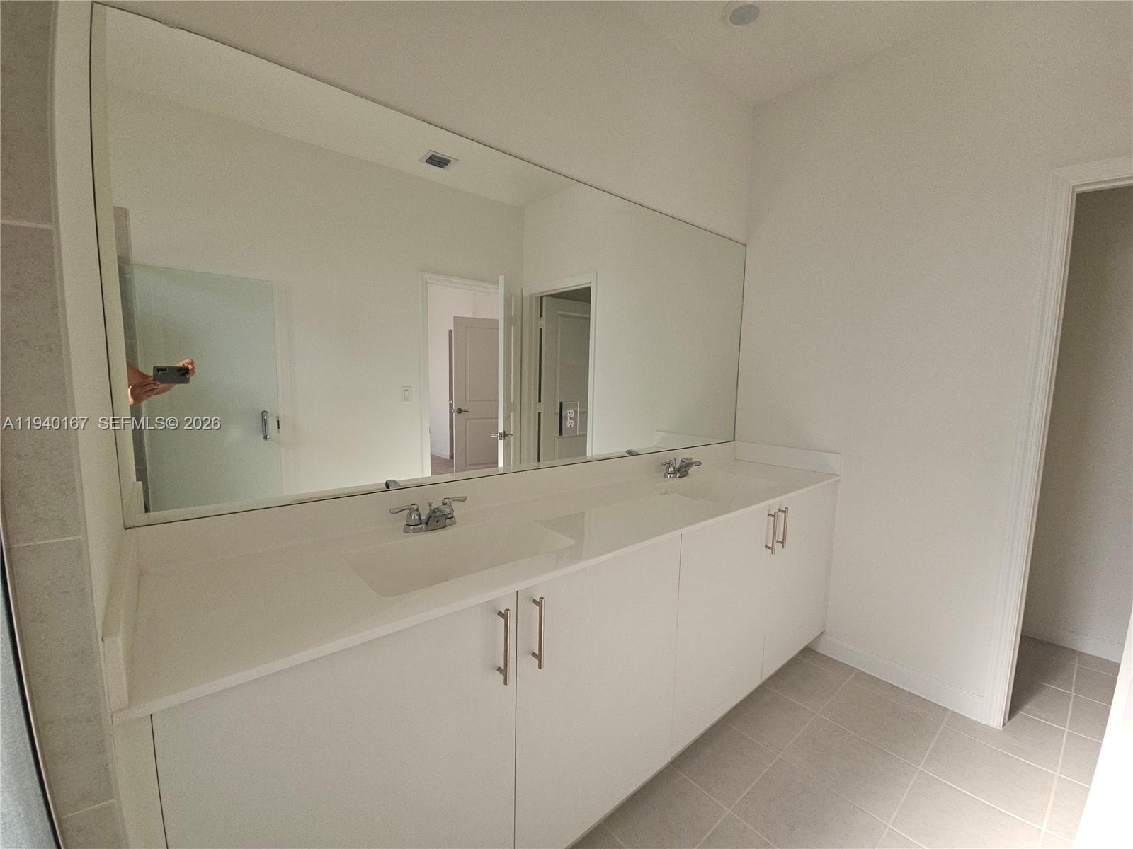 2530 Southeast 29th Street Homestead, FL 33035 - Photo 18 of 21 a bathroom with a sink and a mirror