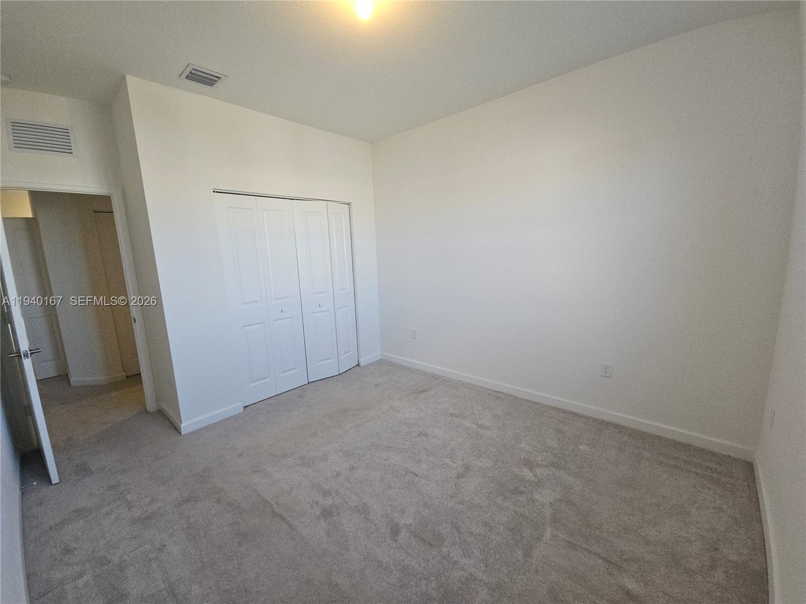 2530 Southeast 29th Street Homestead, FL 33035 - Photo 19 of 21 an empty room with closet