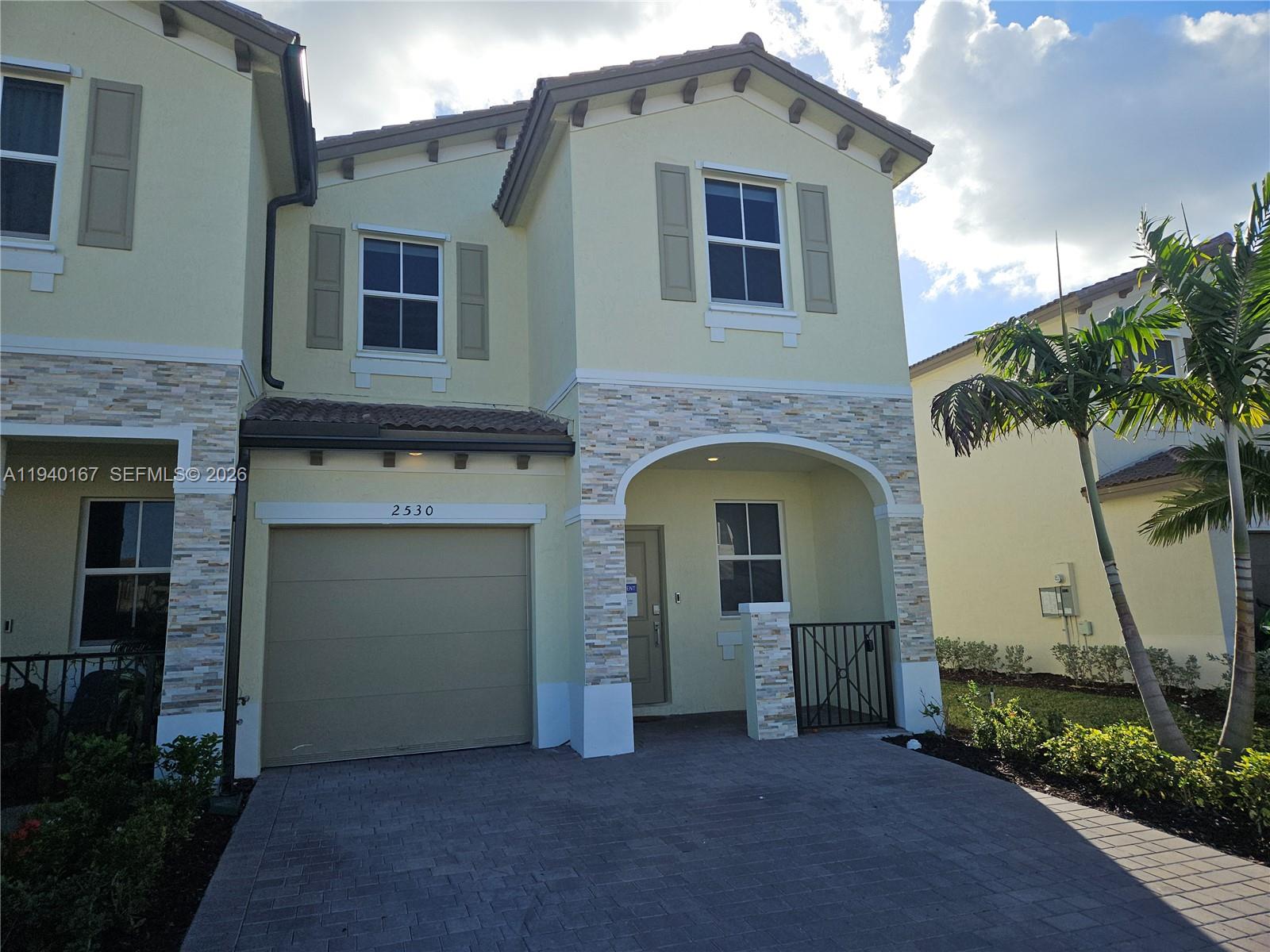 2530 Southeast 29th Street Homestead, FL 33035 - Photo 2 of 21 a front view of a house with garage