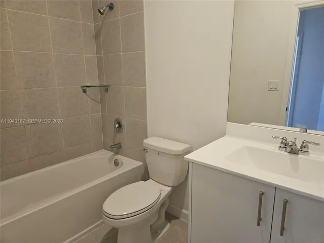a bathroom with a sink a toilet and a bathtub