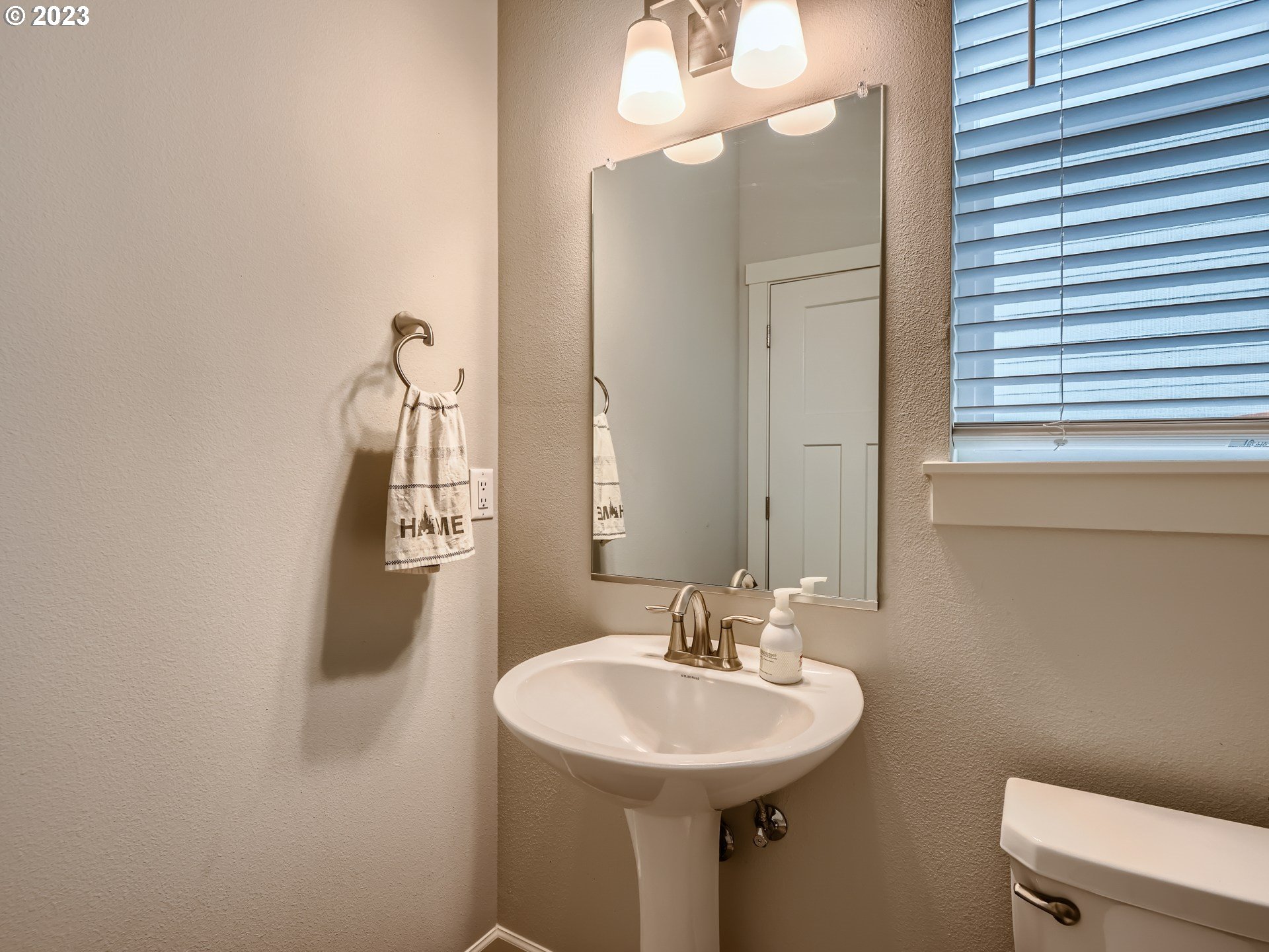 38439 Maple Street Sandy, OR 97055 - Photo 15 of 34 a bathroom with a sink a mirror and a toilet
