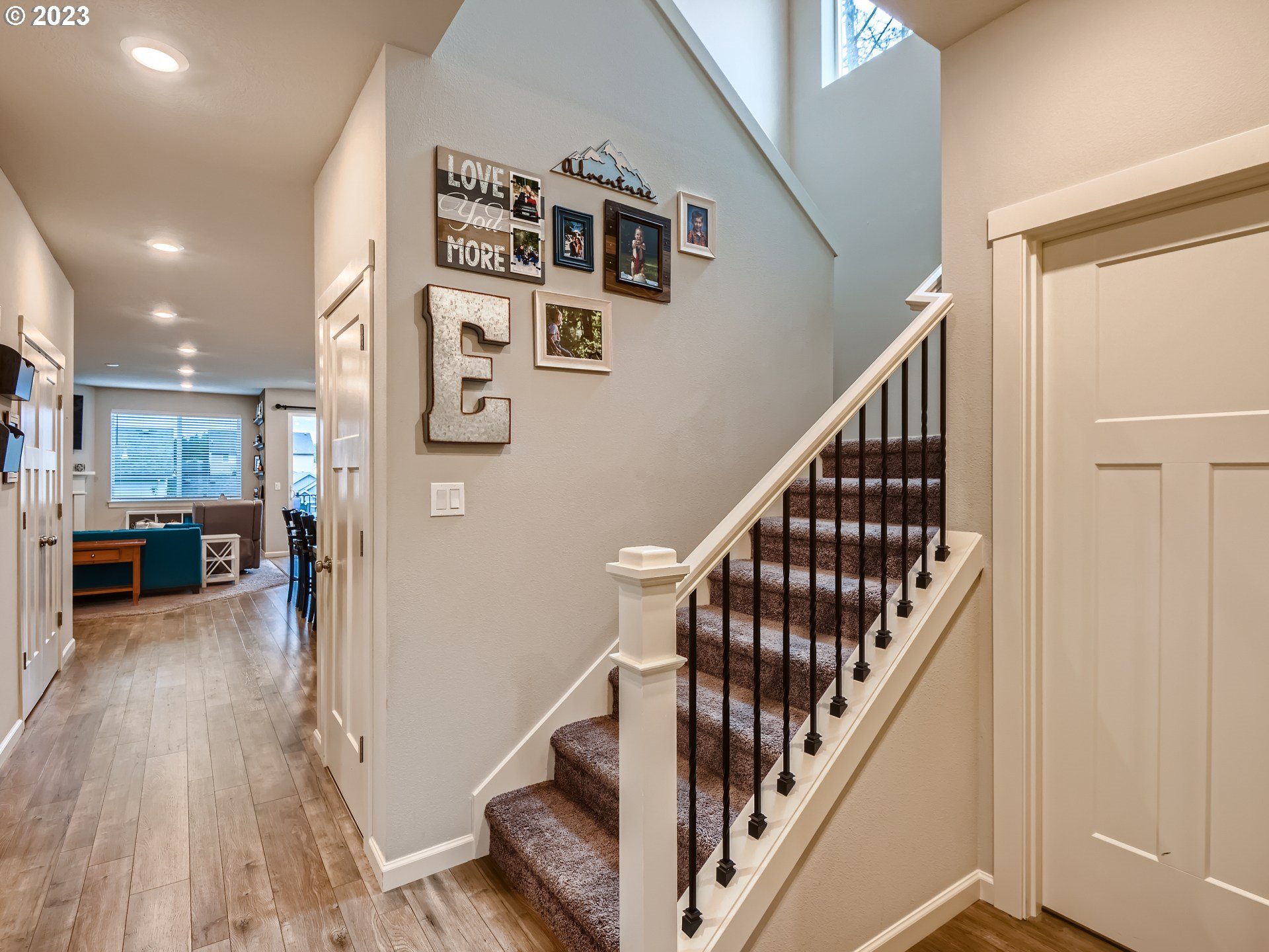 38439 Maple Street Sandy, OR 97055 - Photo 17 of 34 a view of a hallway with wooden floor and staircase