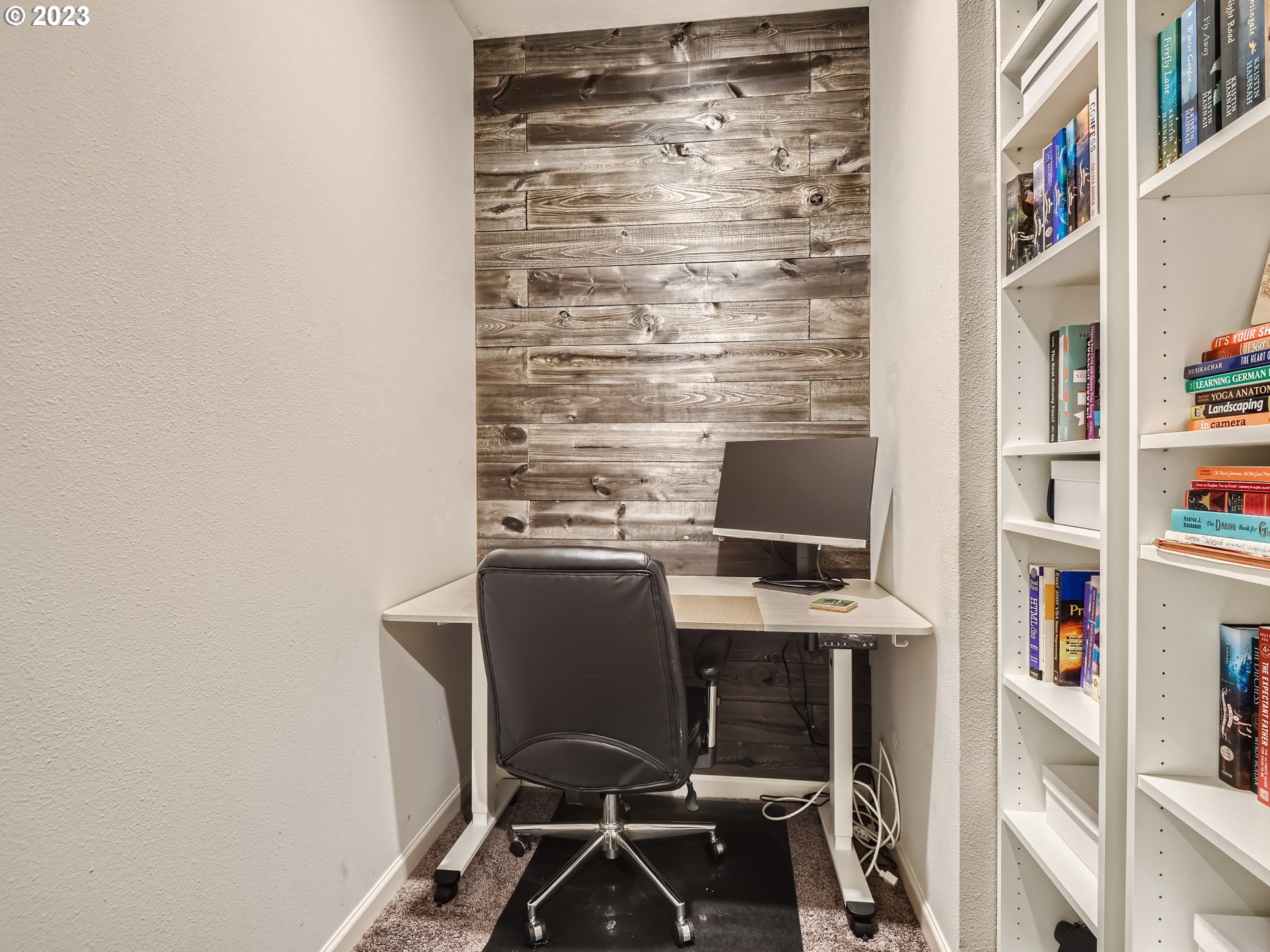 38439 Maple Street Sandy, OR 97055 - Photo 23 of 34 a view of a workspace with furniture and a bookshelf