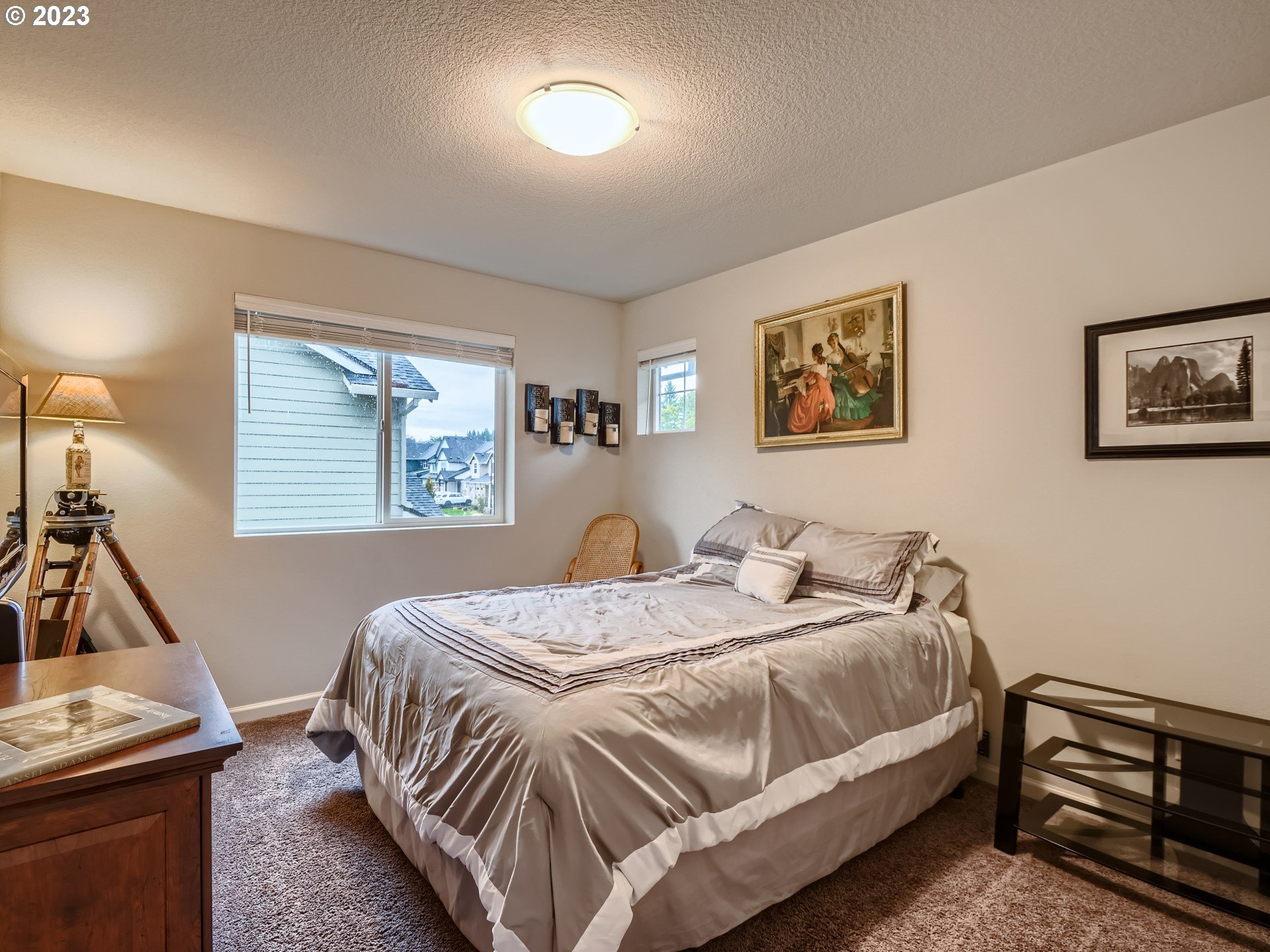 38439 Maple Street Sandy, OR 97055 - Photo 28 of 34 a bed sitting in a bedroom next to a window