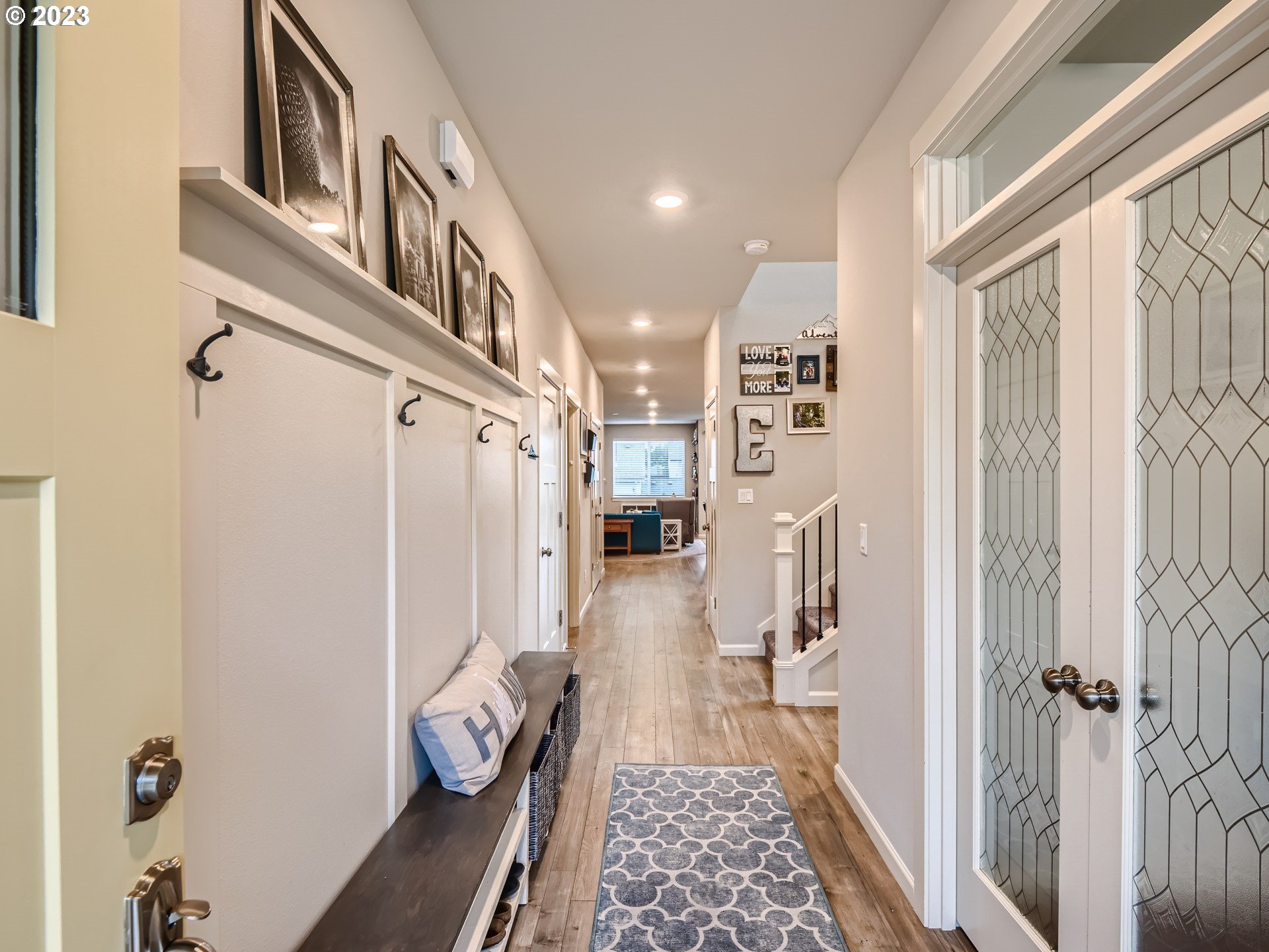 38439 Maple Street Sandy, OR 97055 - Photo 3 of 34 a hallway with painting on the wall and a window