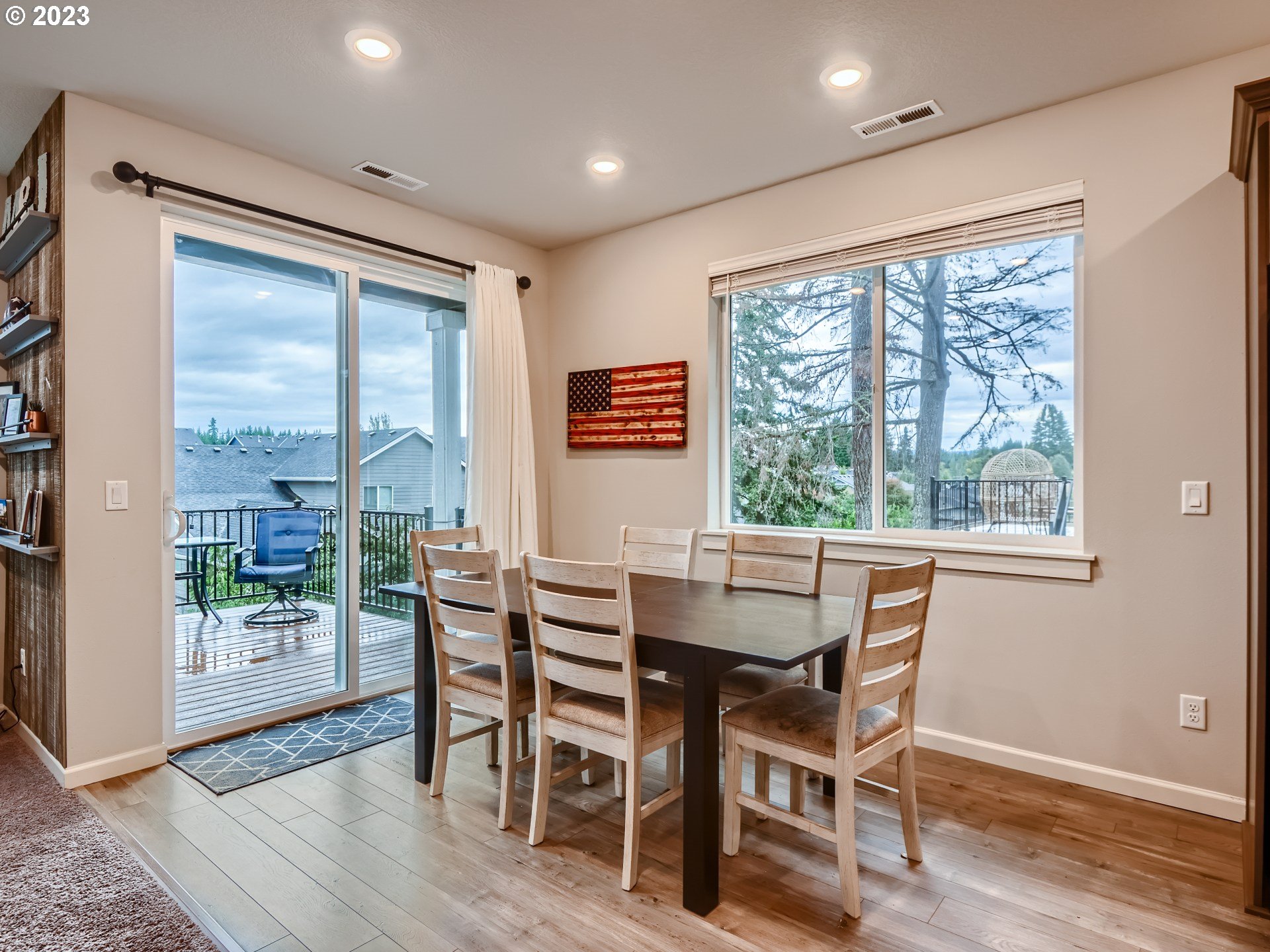 38439 Maple Street Sandy, OR 97055 - Photo 10 of 34 a dining room with furniture large windows and wooden floor