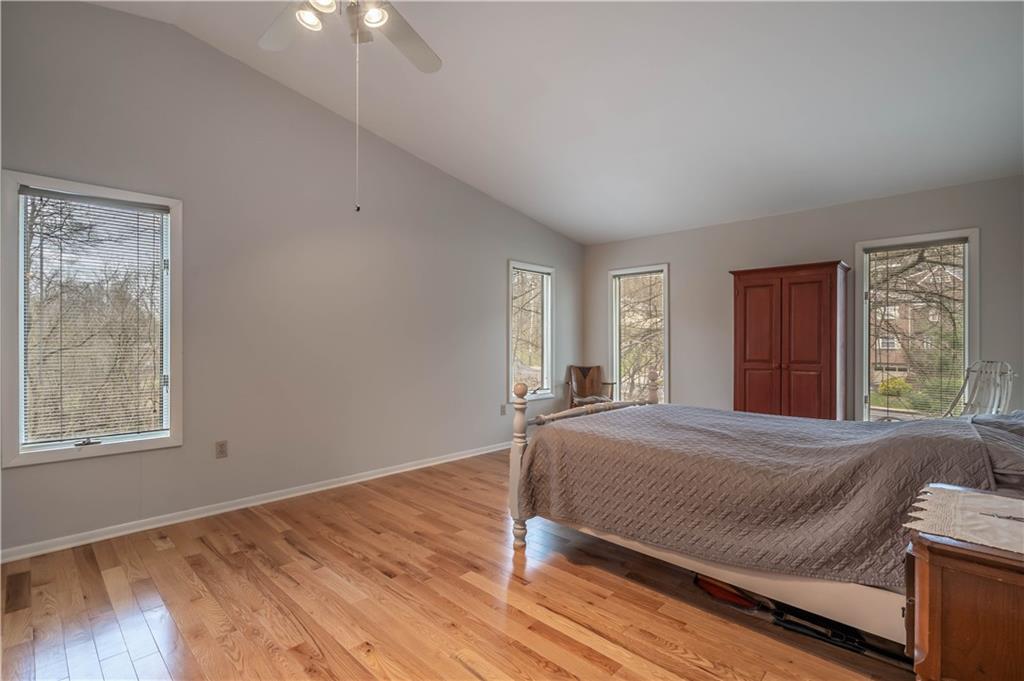 970 Braddock Road Pittsburgh, PA 15221 - Photo 13 of 25 a bedroom with a bed and window