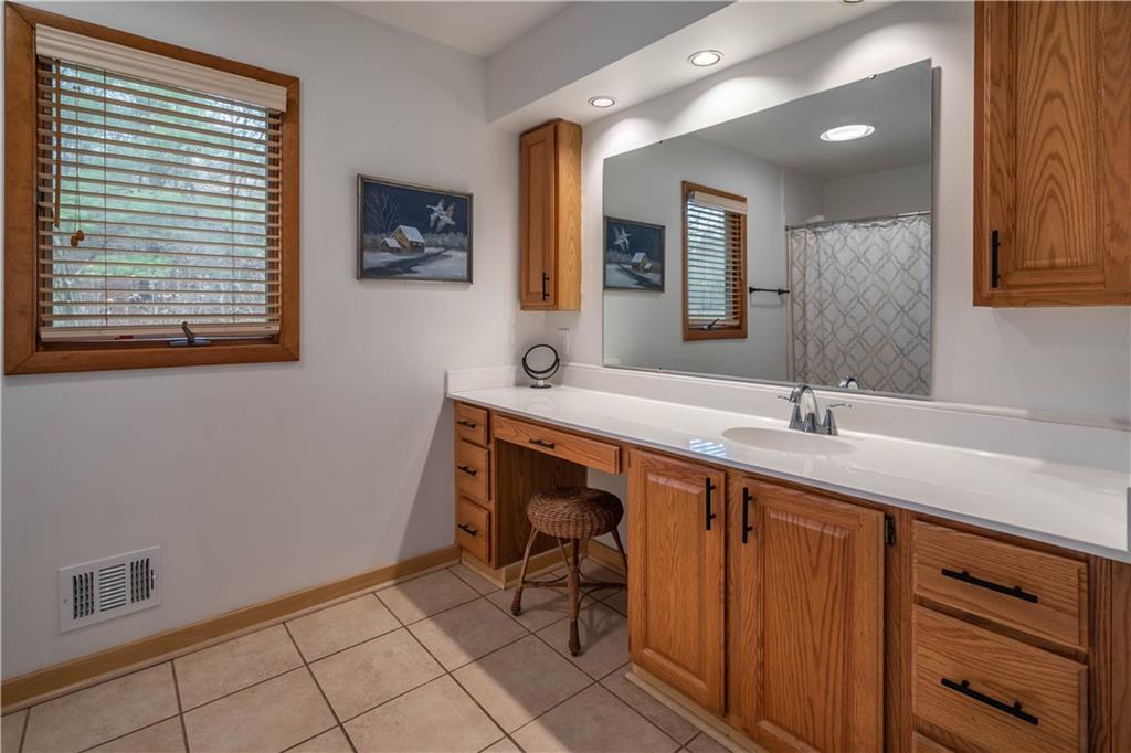 970 Braddock Road Pittsburgh, PA 15221 - Photo 15 of 25 a spacious bathroom with a sink a mirror and a bathtub