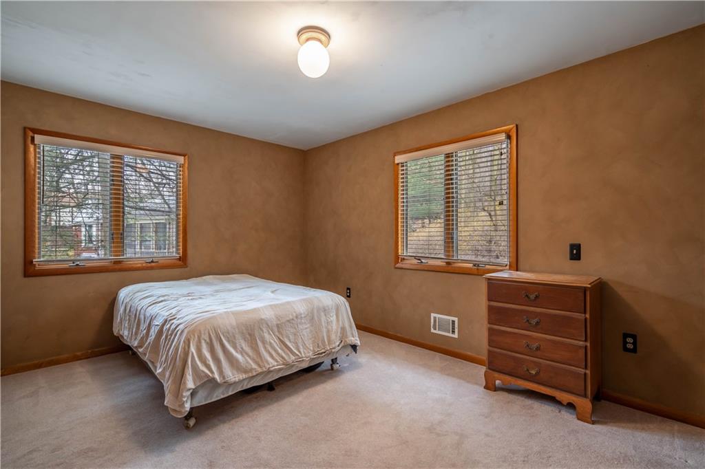 970 Braddock Road Pittsburgh, PA 15221 - Photo 16 of 25 a bedroom with a bed and a window