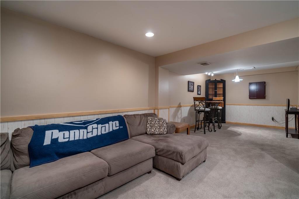 970 Braddock Road Pittsburgh, PA 15221 - Photo 20 of 25 a living room with furniture and a flat screen tv