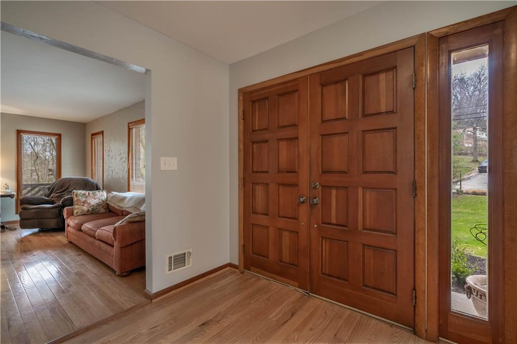 970 Braddock Road Pittsburgh, PA 15221 - Photo 2 of 25 a view of a livingroom with furniture and hardwood floor