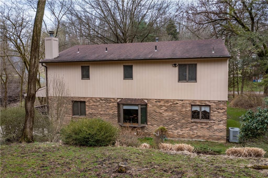 970 Braddock Road Pittsburgh, PA 15221 - Photo 21 of 25 a front view of a house with garden