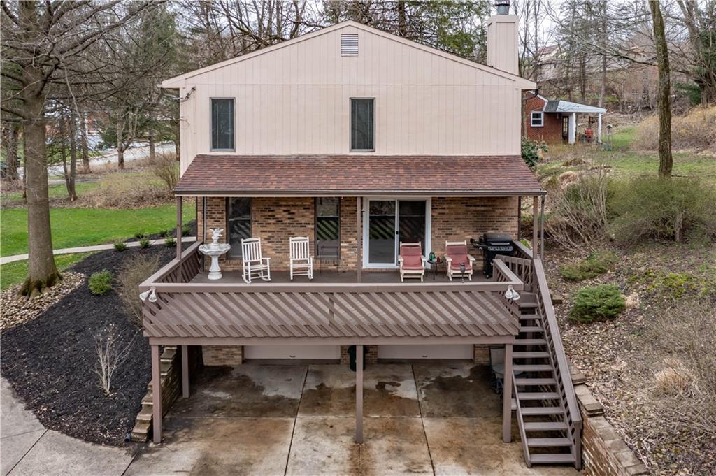 970 Braddock Road Pittsburgh, PA 15221 - Photo 22 of 25 a view of a patio with a table chairs and a yard