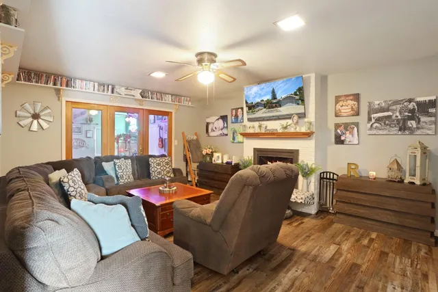 a living room with furniture and a fireplace