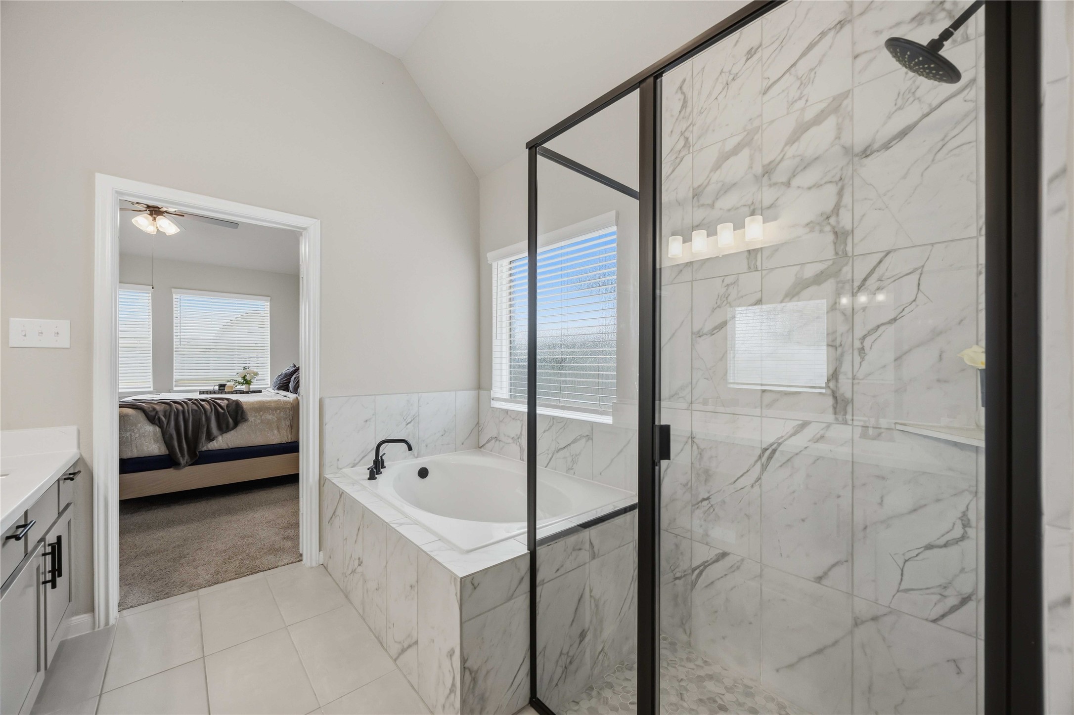 2808 Bisbee Road League City, TX 77573 - Photo 38 of 42 Primary Ensuite- Black Finishes & Marble Inspired Tile Finishes