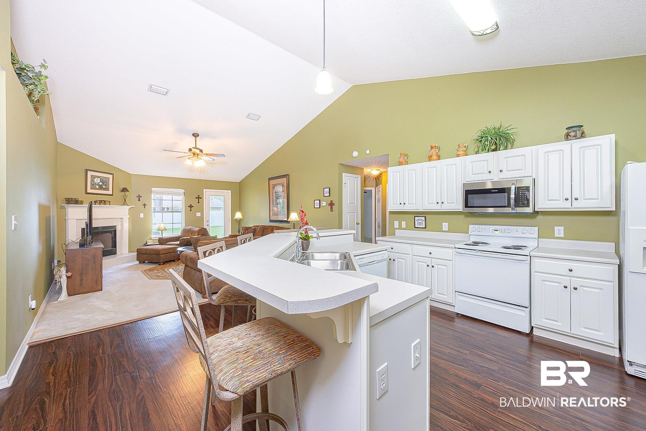16154 Parke Boulevard Foley, AL 36535 - Photo 10 of 44 Kitchen featuring lots of prep space and cabinet storage with vaulted ceiling.
