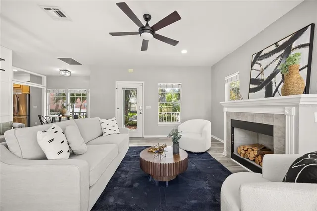 a living room with furniture and a fireplace