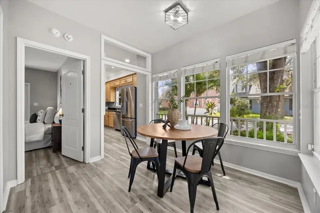 a view of a dining room with furniture window and wooden floor