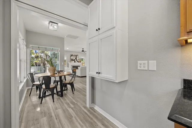 a dining room with furniture and window