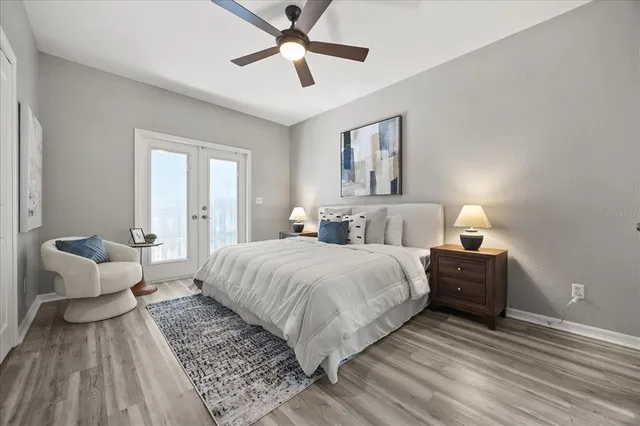 a bedroom with a bed and a chandelier