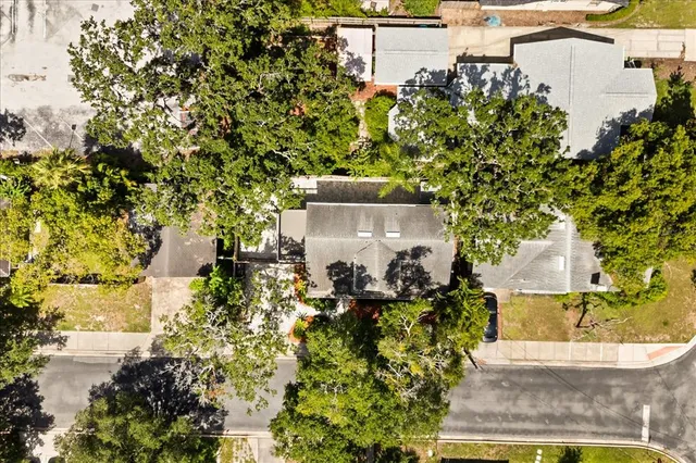an aerial view of residential houses with city view