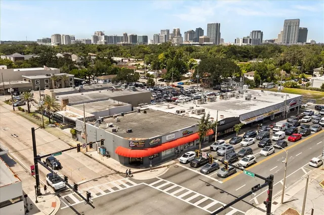 a view of building with cars parked