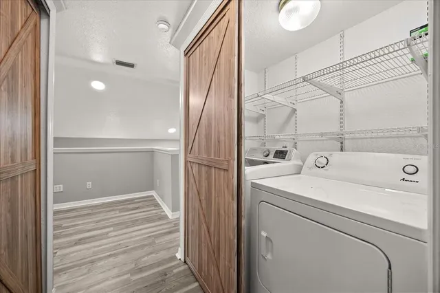 a view of bathroom with a washer and dryer
