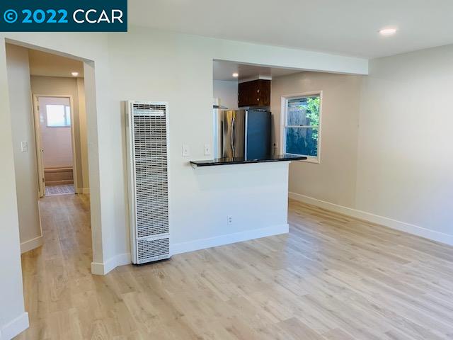 3263 Hillview Lane Lafayette, CA 94549 - Photo 12 of 24 an empty room with wooden floor mirror and windows