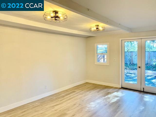 3263 Hillview Lane Lafayette, CA 94549 - Photo 19 of 24 an empty room with wooden floor and windows