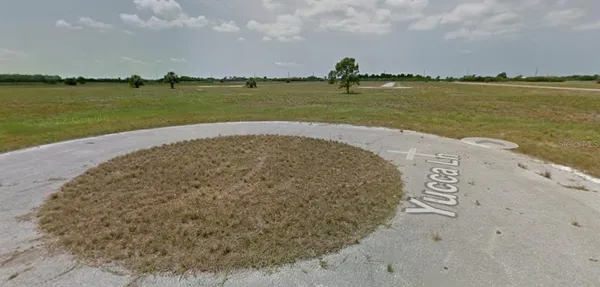 a view of a lake and a yard
