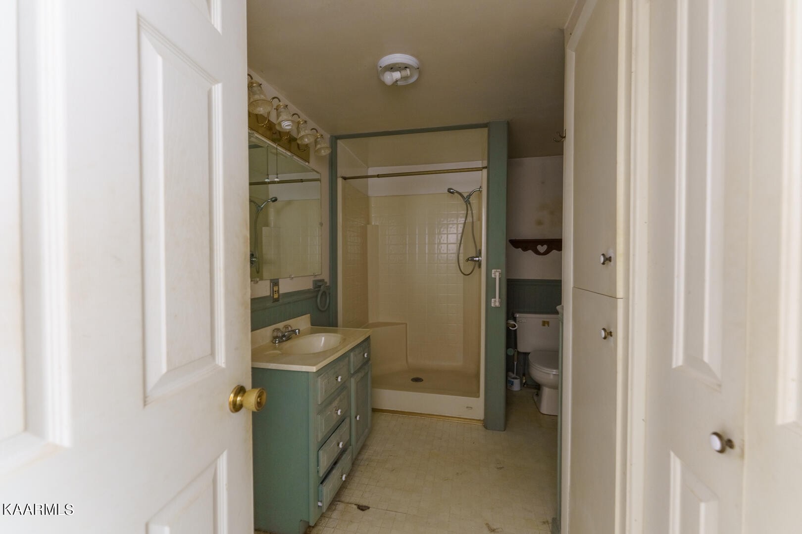203 Duggan Road Lenoir City, TN 37771 - Photo 11 of 16 a bathroom with a granite countertop sink a mirror and a shower
